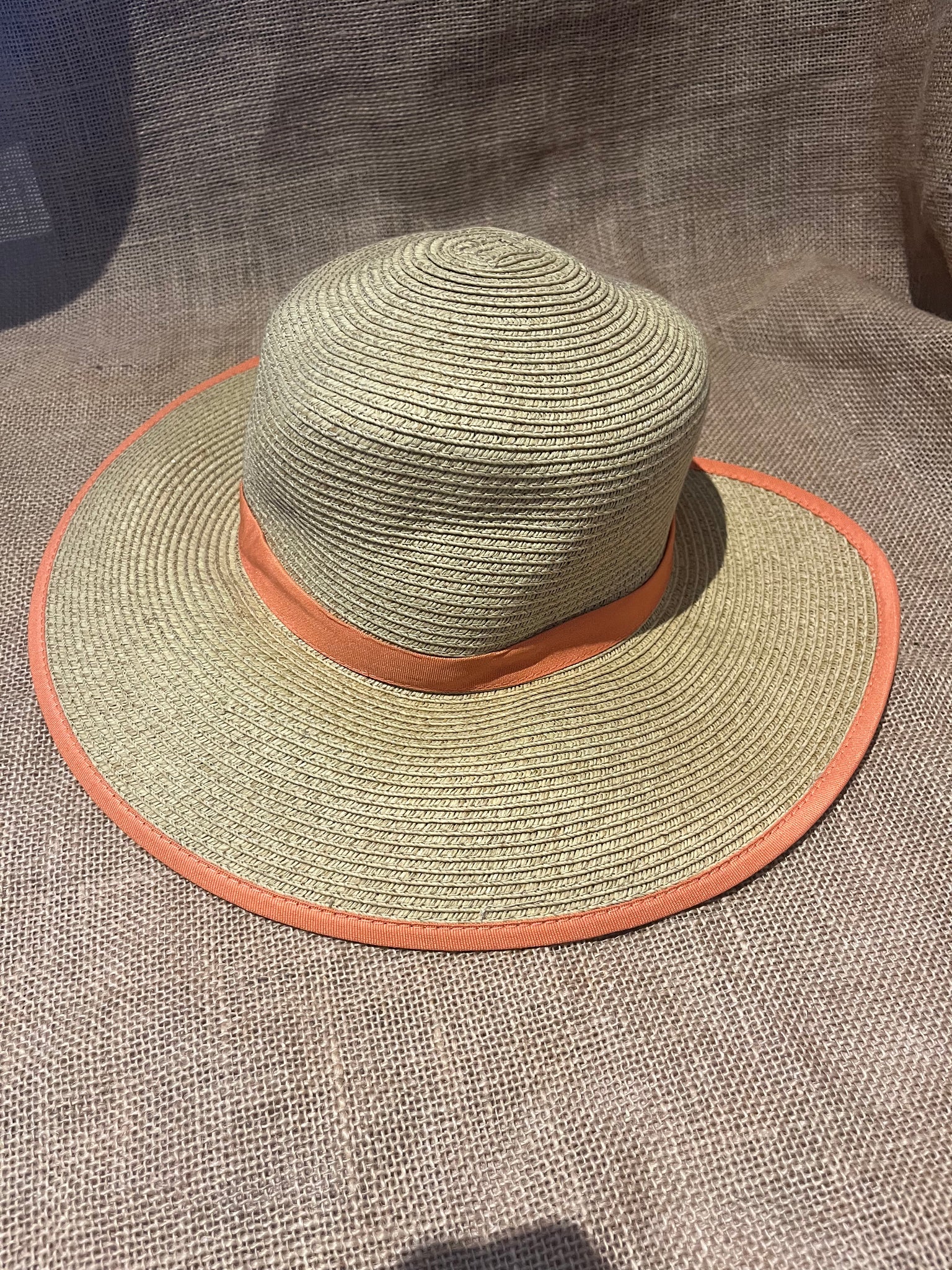 Straw hat with orange trim and ponytail slit